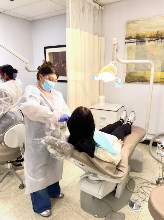 Dental Assisting student practicing chairside care at Lamson Institute