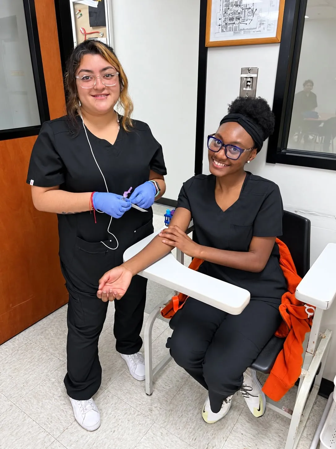 Lamson lab assistant students practicing a blood draw